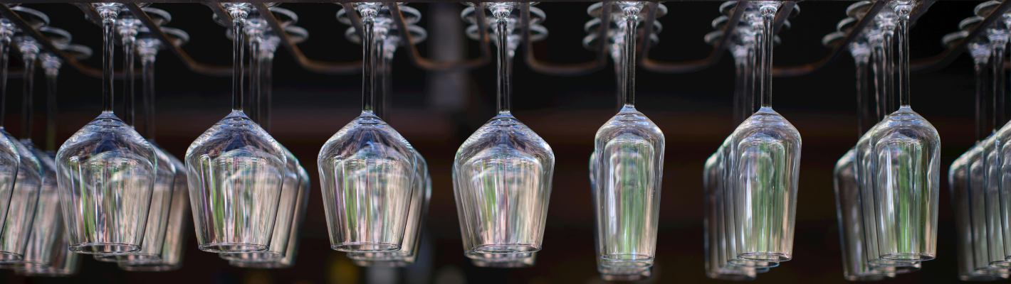 Drinking Glasses Hanging from a Bar Rack